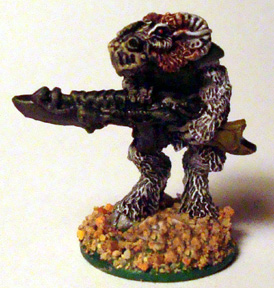 3243b Phagon Beastman with combat-needler - advancing 