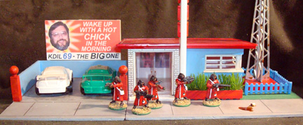 The cars shown are dollar-store finds: 
3 styrene plastic model cars for a dollar.

The figures are 0074 SMG. Rasta 